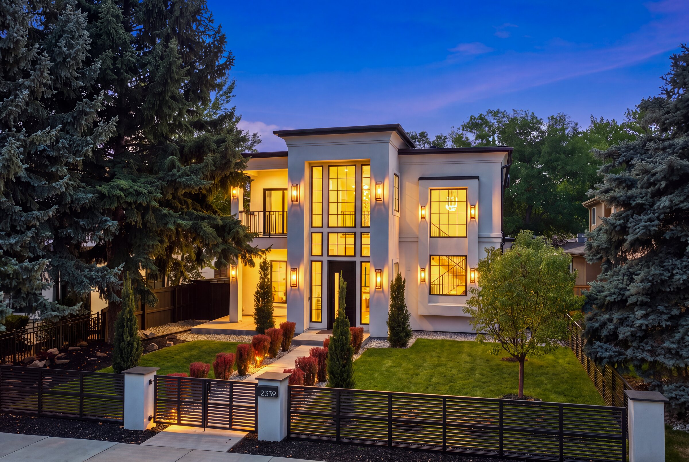 2339 S Saint Paul Street at twilight, every window and sconce lit
